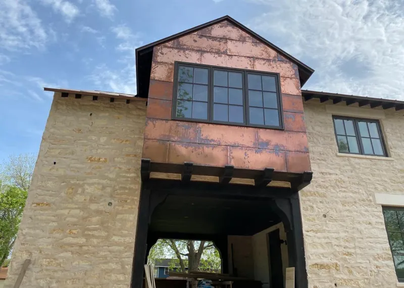 Copper metal panel facade on a stone building for Metal Roof Coating in Folcroft